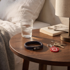 Type 1 diabetes medical alert bracelet and keychain set on a bedside table