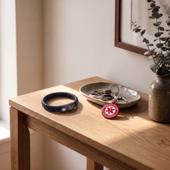 Type 2 diabetes medical alert bracelet and keychain set on a bedside table